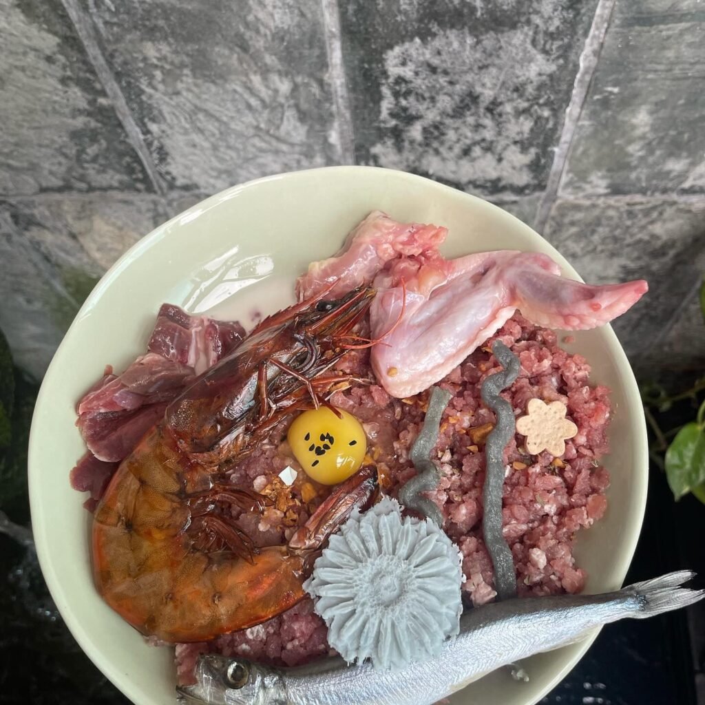 Plate of raw seafood and meat with garnishes